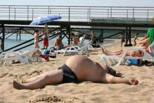 87-fat-guy-in-a-little-beach.jpg